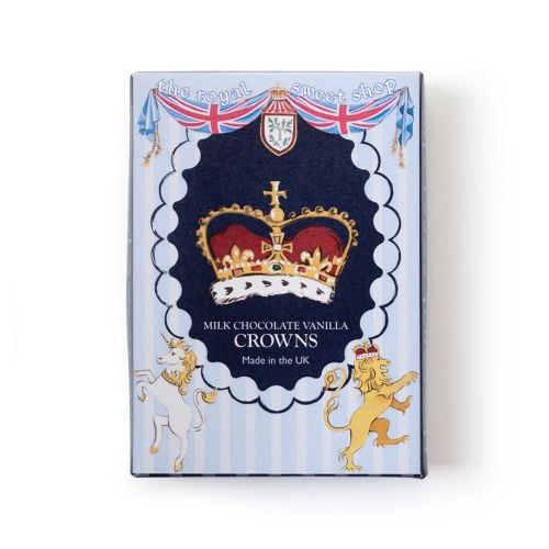 Open box of milk chocolate vanilla crowns from The Royal Sweet Shop, showing nine crown-shaped chocolates arranged in a tray beside the illustrated lid.