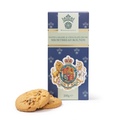Box of Windsor Castle salted caramel and chocolate chunk shortbread rounds with two biscuits placed in front, featuring a royal coat of arms design, 200g.
