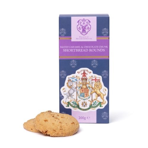 Box of Palace of Holyroodhouse Salted Caramel & Chocolate Chunk Shortbread Rounds, featuring a navy and purple design with the Palace of Holyroodhouse crest and the Royal Coat of Arms on the front. Two shortbread biscuits are displayed in front of the 200