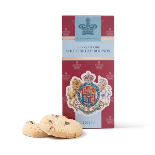 Buckingham Palace All Butter Chocolate Chip Shortbread Rounds in a red presentation box featuring the Royal Coat of Arms, with two round shortbread biscuits placed in front of the packaging.