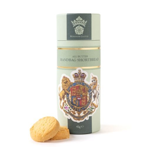 Windsor Castle All Butter Handbag Shortbread 45g in decorative pale green tube featuring royal coat of arms, with two round shortbread biscuits displayed beside the packaging.