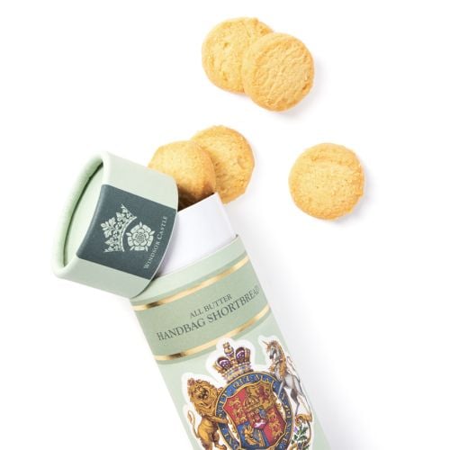Windsor Castle All Butter Handbag Shortbread 45g in decorative pale green tube featuring royal coat of arms, with two round shortbread biscuits displayed beside the packaging.