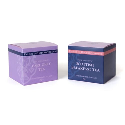 Finest Leaf Tea Gift Duo from The Royal Pantry, presented in a pale blue gift box with a clear window displaying Earl Grey Tea and Scottish Breakfast Tea from the Palace of Holyroodhouse range. Two pyramid tea bags filled with loose tea leaves are positio