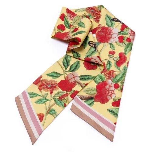 Yellow silk twilly scarf with red floral blossoms, green leaves and butterfly motifs, finished with a pink and taupe striped border.