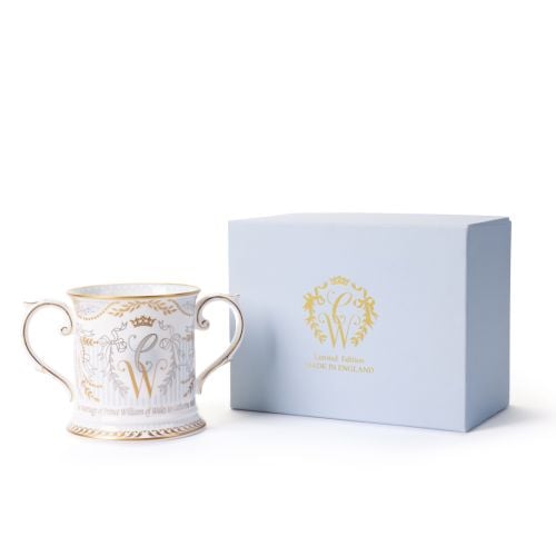 Limited-edition fine bone china commemorative mug with ornate gold and grey decoration, intertwined “C” and “W” monogram, and matching pale blue presentation box.