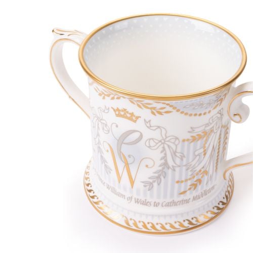 Limited-edition fine bone china commemorative mug with ornate gold and grey decoration, intertwined “C” and “W” monogram, and matching pale blue presentation box.
