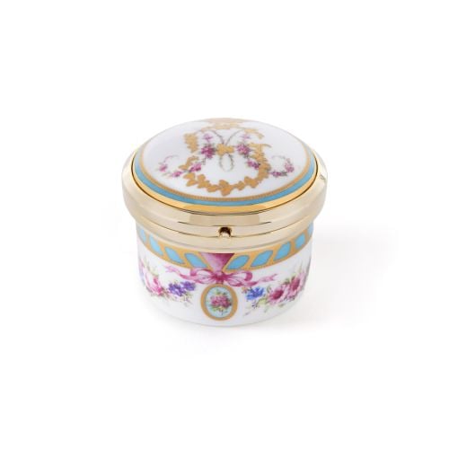 Open Buckingham Palace porcelain pillbox clock featuring a gold-tone analogue clock with Roman numerals, floral bone china base and hinged lid with gold trim.