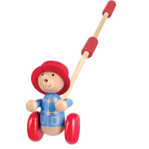Wooden Paddington Bear toy with red farbic hat and stick to push the toy along on wheels.