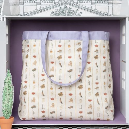 Tote bag with illustration of exterior of Queen Mary's Dolls' House with lilac handles.