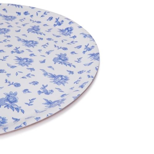 Round white tray with blue illustrated flowers, petals and leaves covering the entire tray.