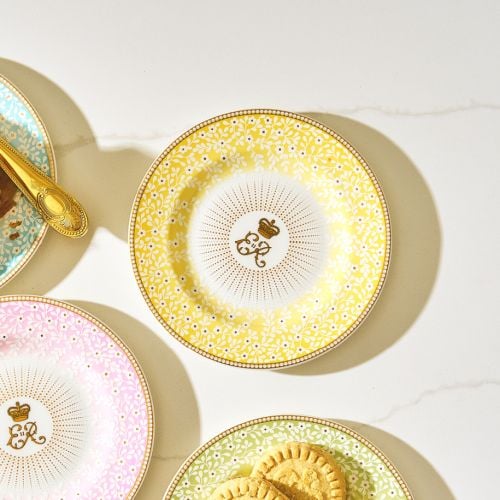 Yellow floral Queen Elizabeth II plate with gold gilding and cypher with central sunbeam pattern. 