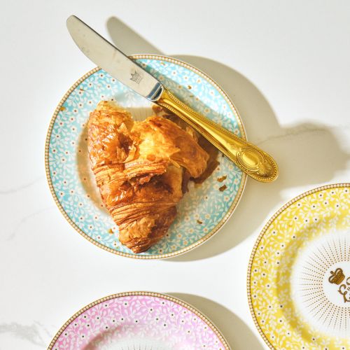 Blue Queen Elizabeth Centenary plate with cypher surrounded by sunbeam pattern as well as a floral blue print with gilding. 