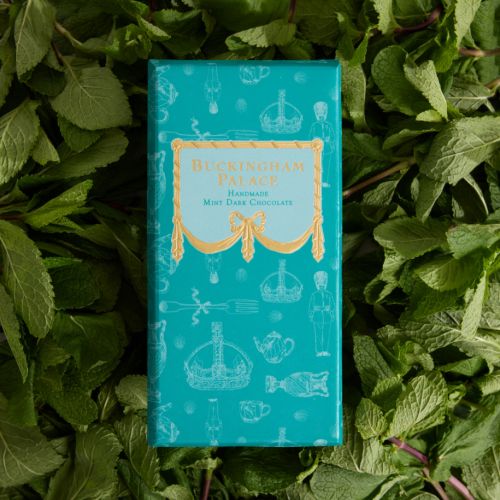 Bar of Buckingham Palace mint chocolate in teal packaging sleeve with gold detail. Illustrated with items from the Royal Collection.