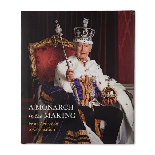 Front cover of book featuring an official portrait of King Charles III on his Coronation day.