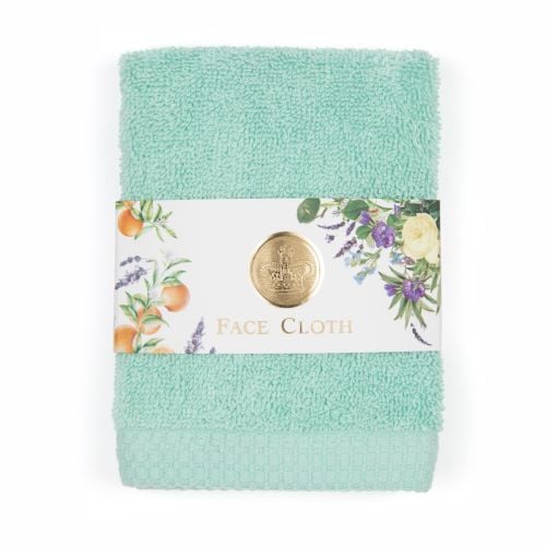 green face cloth with packaging around middle with floral illustrations and crown in gold stamp