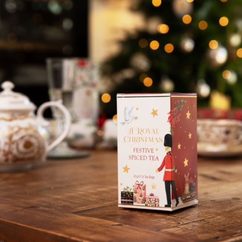 packaging of festive spiced tea with illustrations of a guardsman, presents and a dove surrounded by stars