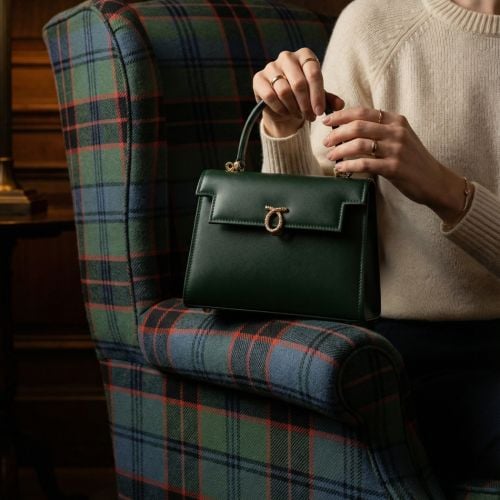 Front of Forest green Launer Judi bag featuring iconic Launer branded clasp. 