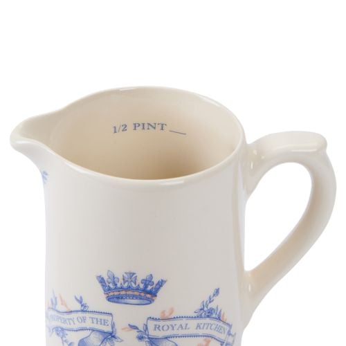 Cream earthenware half pint milk jug with blue crown and banner stating property of the Royal kitchen