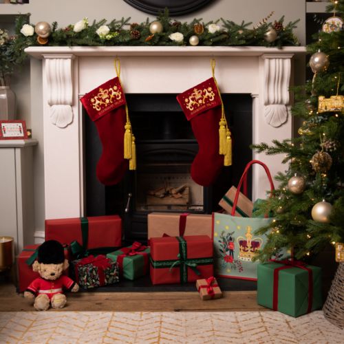 two stockings hung over a fireplace