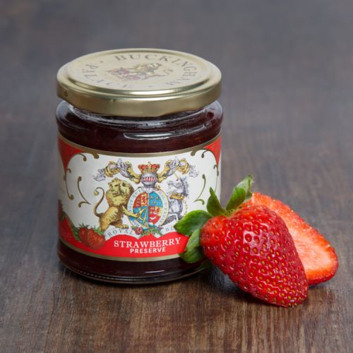glass jar of strawberry jam with a Buckingham Palace royal crest label round the jar 