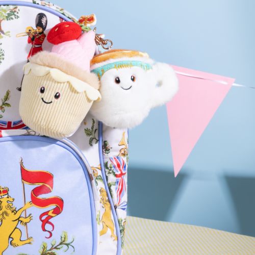 Teacup plush keyring with a smiley face. 