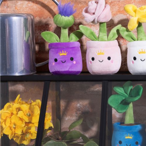 Purple Palace of Holyroodhouse thistle pot Plush with smiley face and crown on pot. 