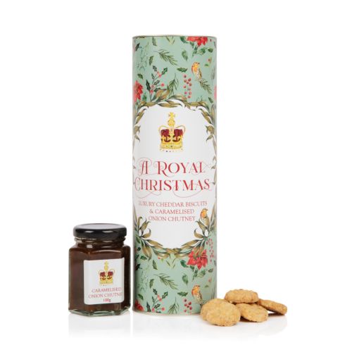 tube packaging of the chutney and biscuit set with a mint green tube and illustrations to match plus jar of caramelised onion chutney and pile of cheddar nibbles