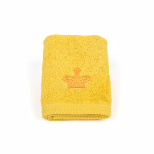 Yellow face cloth in floral packaging with gold stamp