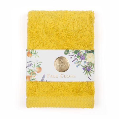 Yellow face cloth in floral packaging with gold stamp