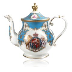 Royal coat of arms English fine bone china 6 cup Teapot featuring a lion and unicorn royal crest surrounded by ornated gold patterns and English flower patterns on a turquoise blue coloured background. The lid is topped with with a royal gold crown. 