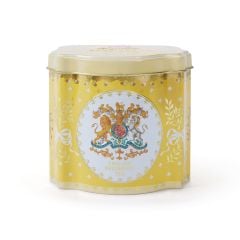 Tin tea caddy is yellow and decorated with the Royal Coat of Arms, leaves tied with bows and acorns.  