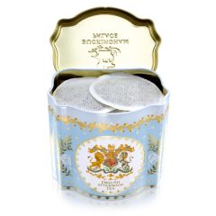 Open tin with view of round tea bags inside. 