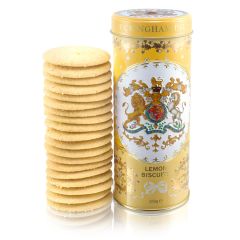 yellow tin with floral decoration and the crest and the centre of the tin. Stood next to a pile of lemon biscuits