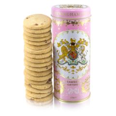 pink biscuit tin with the crest at the centre of the tin. Stood next to a tower of strawberry biscuits