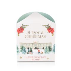 square packaging of truffles including buckingham palace on the front and gaurdsman pulling a dog on sleigh
