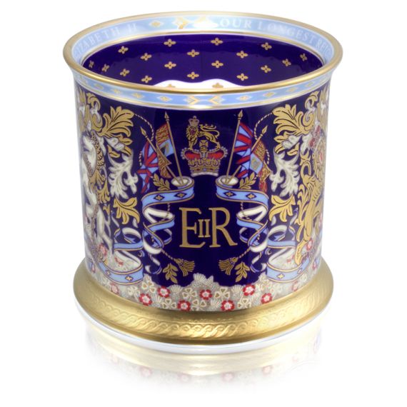 The EIIR insignia and flag design is on the side of this tankard. Surrounded with a purple, light blue and gold design