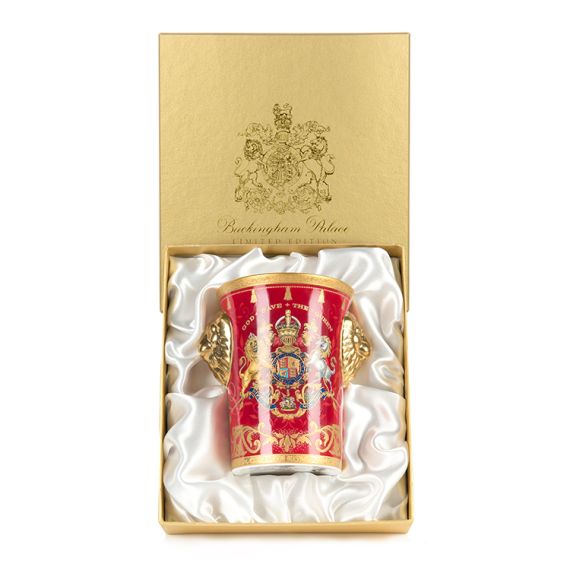 Gold presentation box with tall Lionhead Beaker, featuring gold lion handes, royal coat of arms of Queen Elizabeth II inscribed with "God Save The Queen." Gold presentation box with tall Lionhead Beaker, featuring gold lion handes, royal coat of arms of Queen Elizabeth II inscribed with "God Save The Queen."