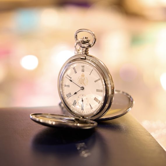 Detail of clockface of the Chrome Livery Pocket watch, featuring the insignia of King Charles III. Detail of clockface of the Chrome Livery Pocket watch, featuring the insignia of King Charles III.