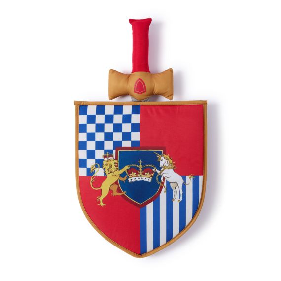 Front of sword and shield toy featuring a colourful shield with red and blue deisgn, featuring a crown at centre with a lion and unicorn to each side, with a sword behind. Front of sword and shield toy featuring a colourful shield with red and blue deisgn, featuring a crown at centre with a lion and unicorn to each side, with a sword behind.