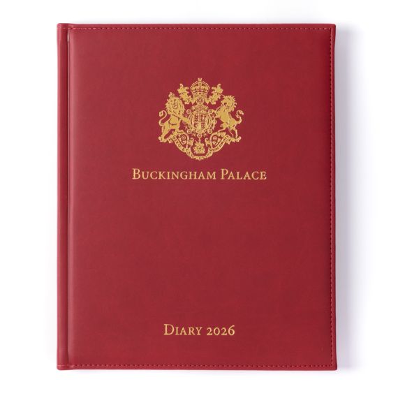 Red desk diary with gold embossed crest and lettering, Buckingham Palace Diary 2026.