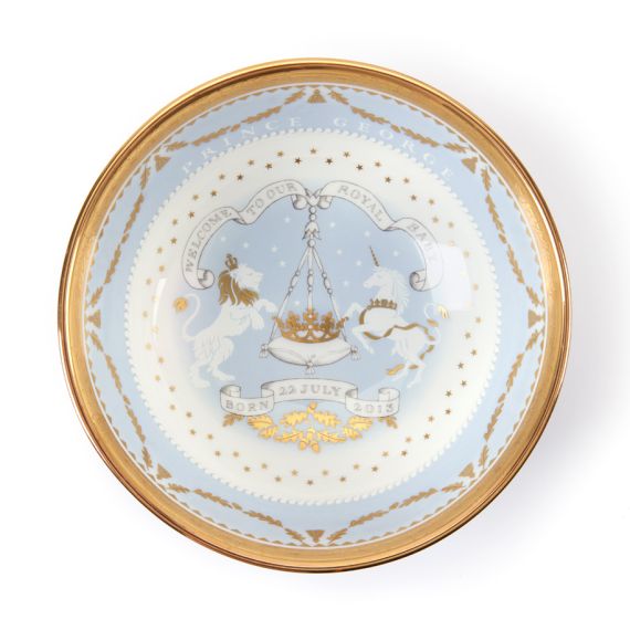 Blue commemorative bowl with featuring gold gilding as well as a lion and unicorn with date of birth. 