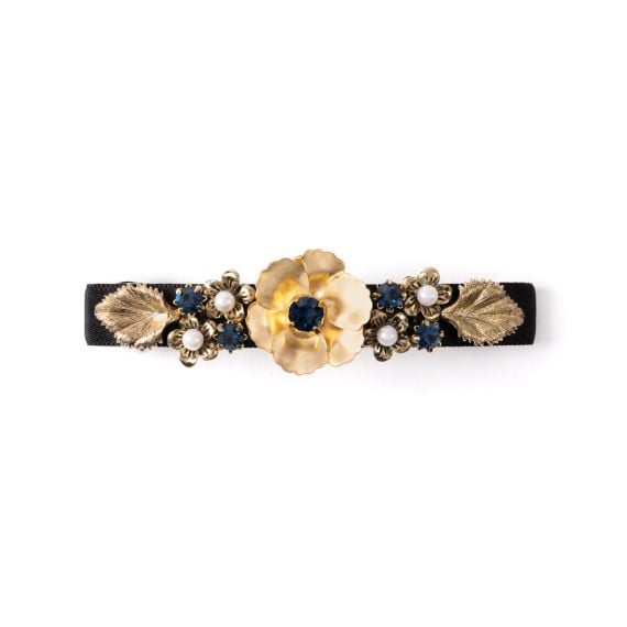 Hair clip with gold flower details and pearl and gem studs. 