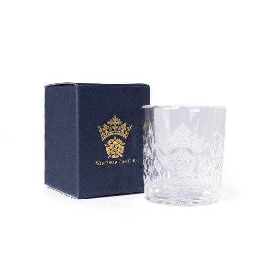 Clear cut-glass tumbler engraved with the Windsor Castle crest, shown beside a navy box with gold crest and text.