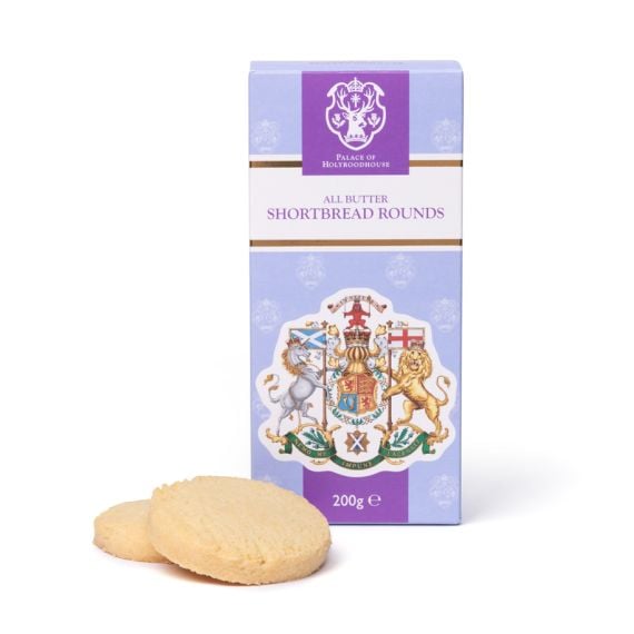 Box of Palace of Holyroodhouse All Butter Shortbread Rounds (200g) in pastel purple and white packaging with a royal crest design, standing upright against a white background. Two round golden shortbread biscuits are displayed in front of the box.