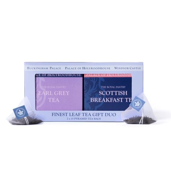 Finest Leaf Tea Gift Duo from The Royal Pantry, presented in a pale blue gift box with a clear window displaying Earl Grey Tea and Scottish Breakfast Tea from the Palace of Holyroodhouse range. Two pyramid tea bags filled with loose tea leaves are positio
