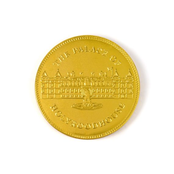 Gold chocolate coin with Palace of Holyrood House facade. Gold chocolate coin with Palace of Holyrood House facade.