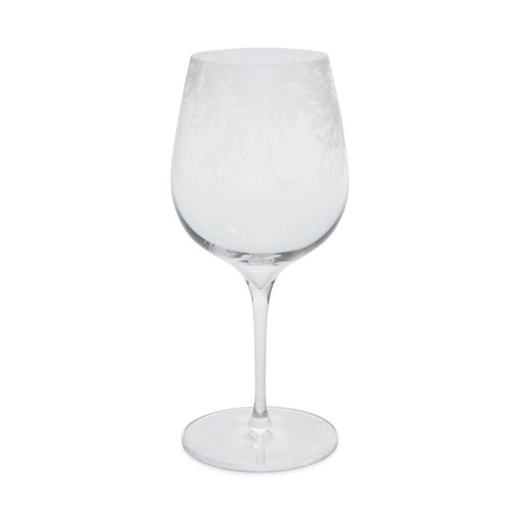 Crystal red wine glass with an etched design. Crystal red wine glass with an etched design.