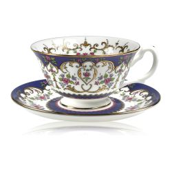 Queen Victoria teacup and saucer with design featuring Queen Victoria's name cipher surrounded by floral patterns and gold plated rim.