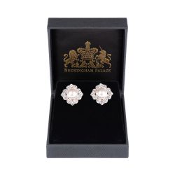 Pair of diamond shape base metal earrings featuring a large pearl in the middle surrounded by embeded  crystal stones.