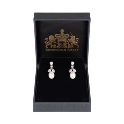 Pair of drop crystal earrings featuring a tear drop natural colour pearl supported by leave and circle shaped crystals. 